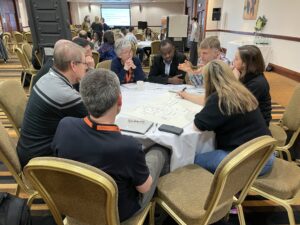 Participants working in groups at a table during the interactive session on sustainable biorefineries. 